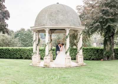 Wedding photograph showing bride and groom kissing at wedding venue near Pontefract