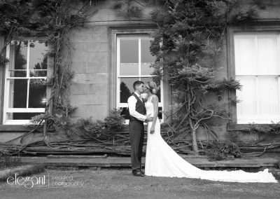 Bride and groom embracing naturally at one of the best wedding venues Yorkshire