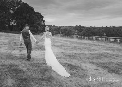 Bride and groom outside a stunning venue for a wedding
