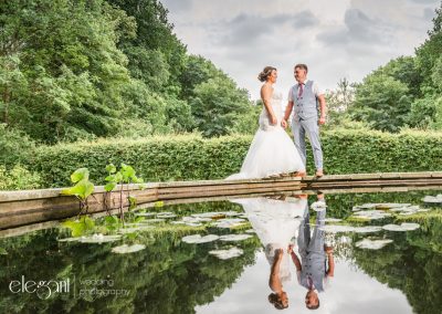 Doncaster wedding photography of bride and groom with reflection in water
